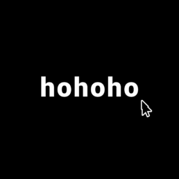 The word “hohoho” in bold white text on a black background with a white cursor arrow next to it, blending holiday cheer with minimalist digital aesthetics.