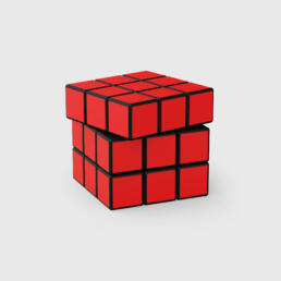 A Rubik’s Cube with all visible sides showing red tiles, partially twisted, against a light gray background.