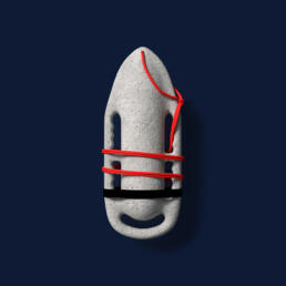 A textured, stone-gray flotation device shaped like a rescue buoy, wrapped with bright red cord, on a dark blue background.